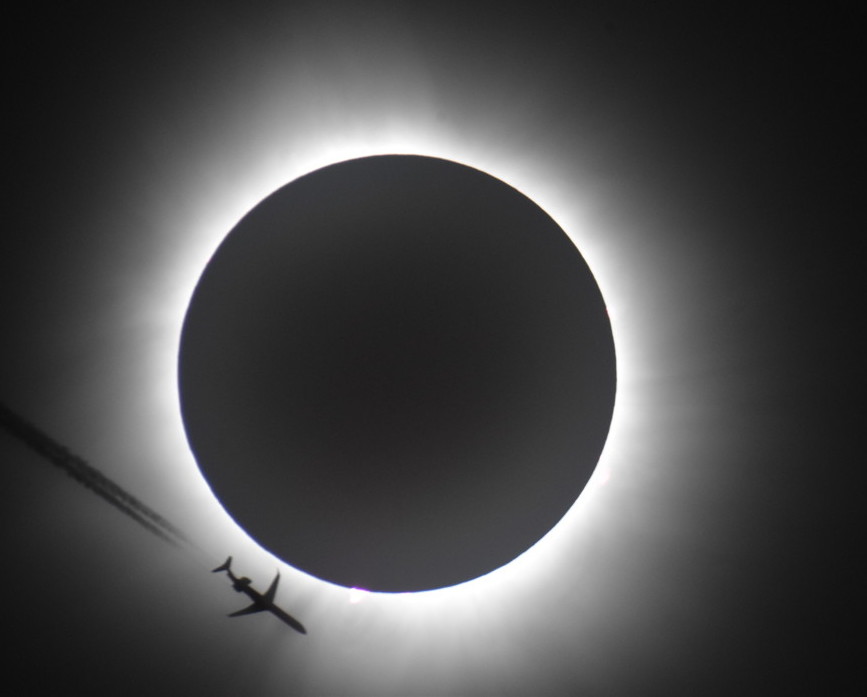 Solar eclipse with airplane transit 2024