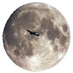 full moon with airplane transit